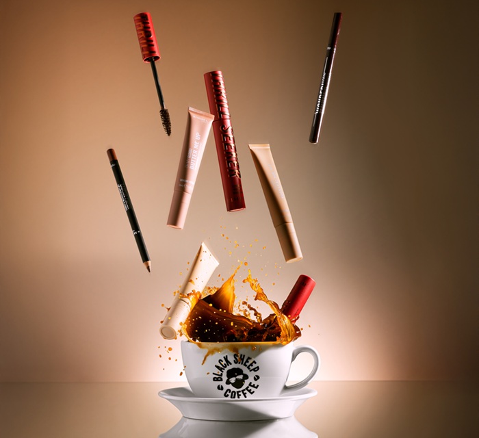 Graphic image showing Rimmel London products falling into a cup of coffee